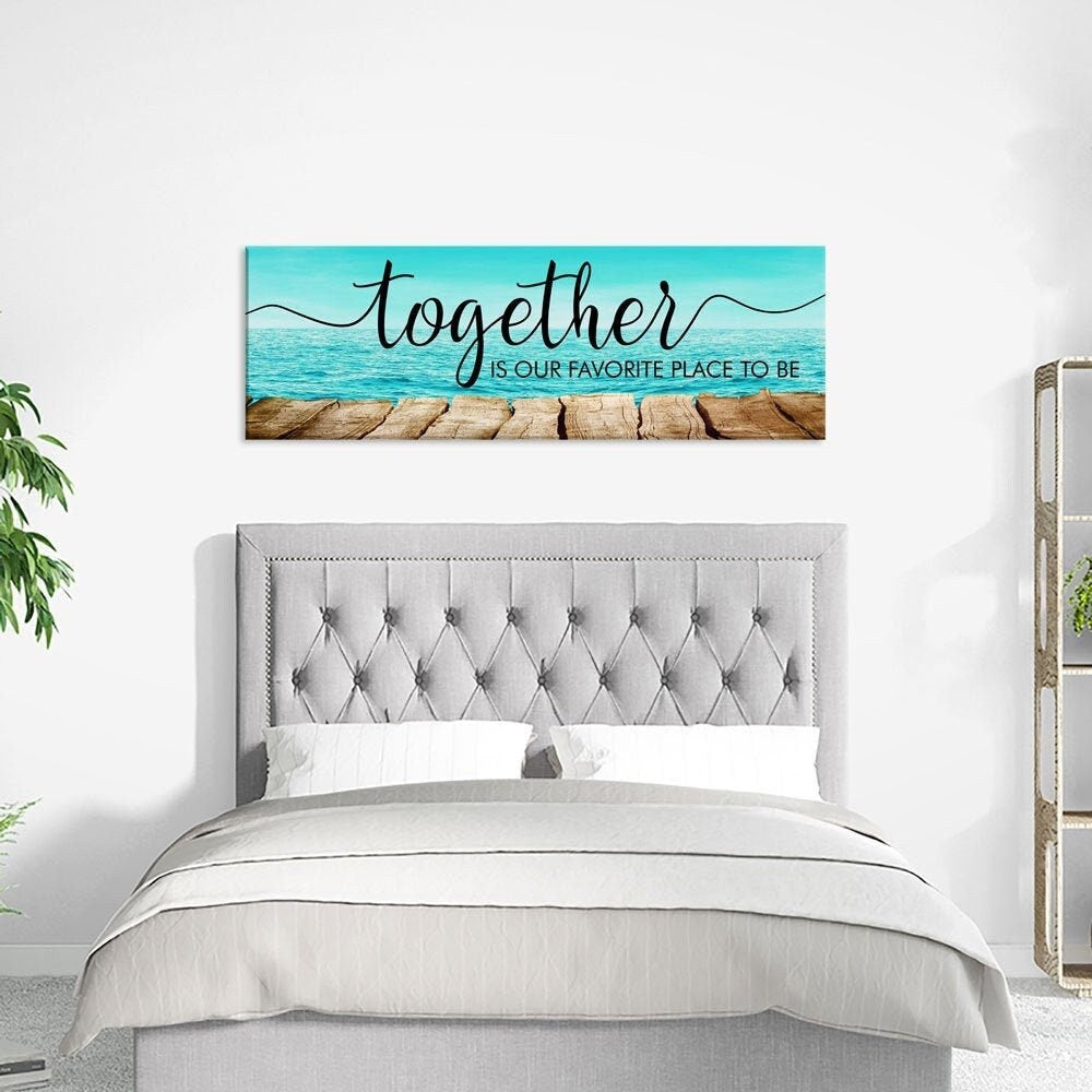 Together is our favorite place couples quote canvas above a bed