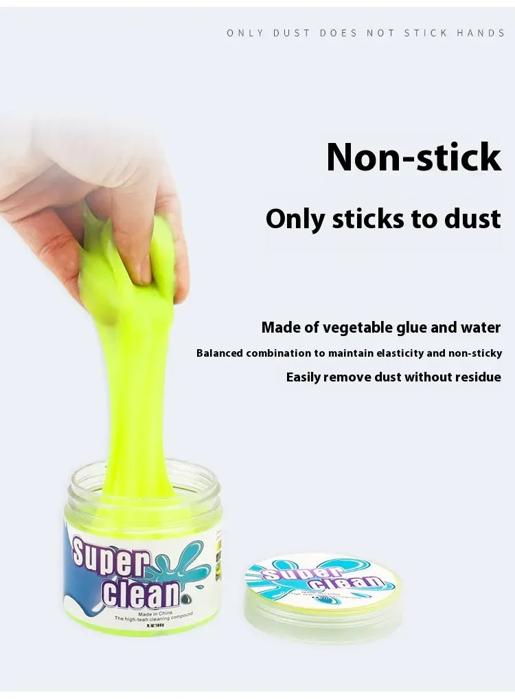 Non-sticky cleaning gel stretched from jar showing texture