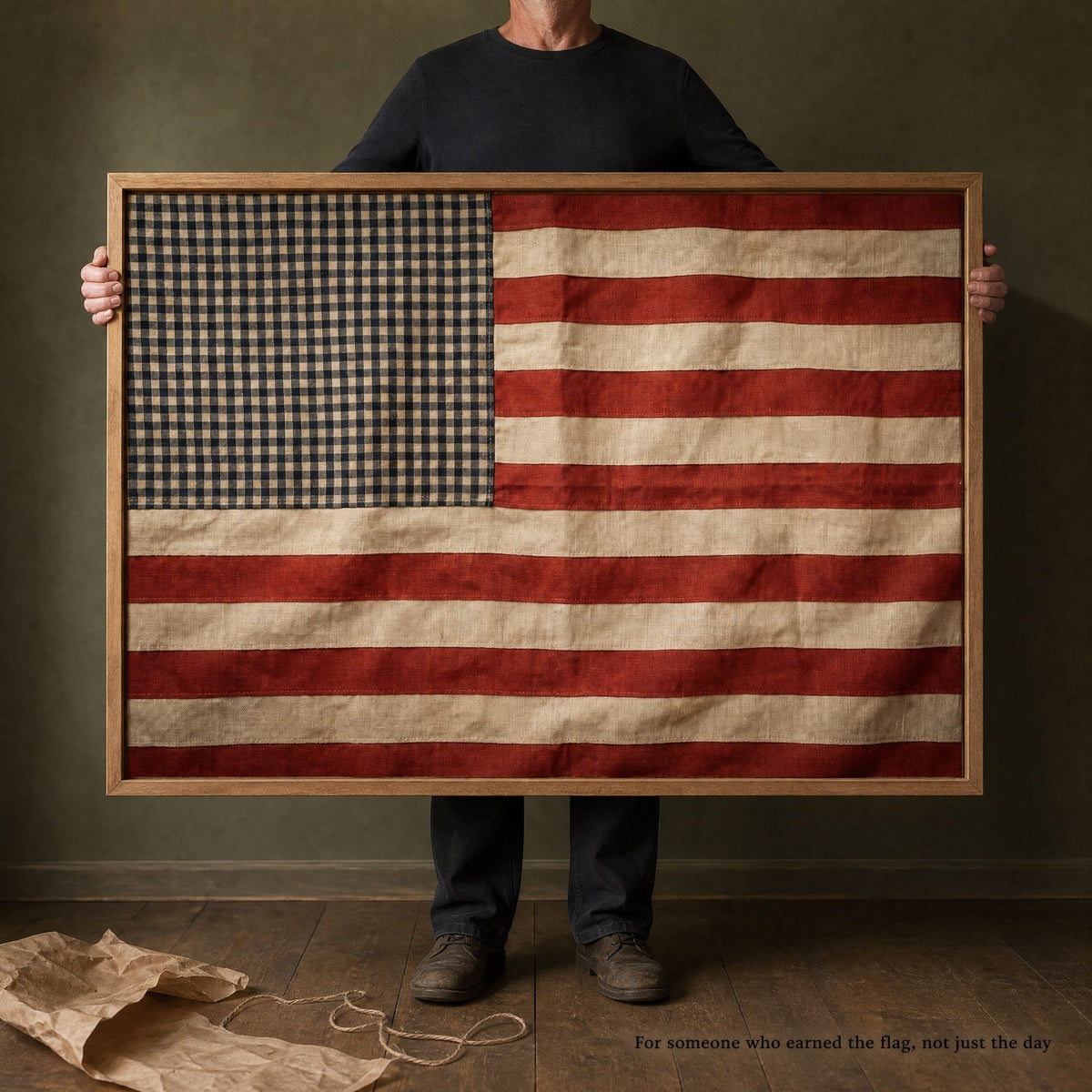 A man holding the 40 by 28 inch framed vintage American flag print, shown at full size against his body
