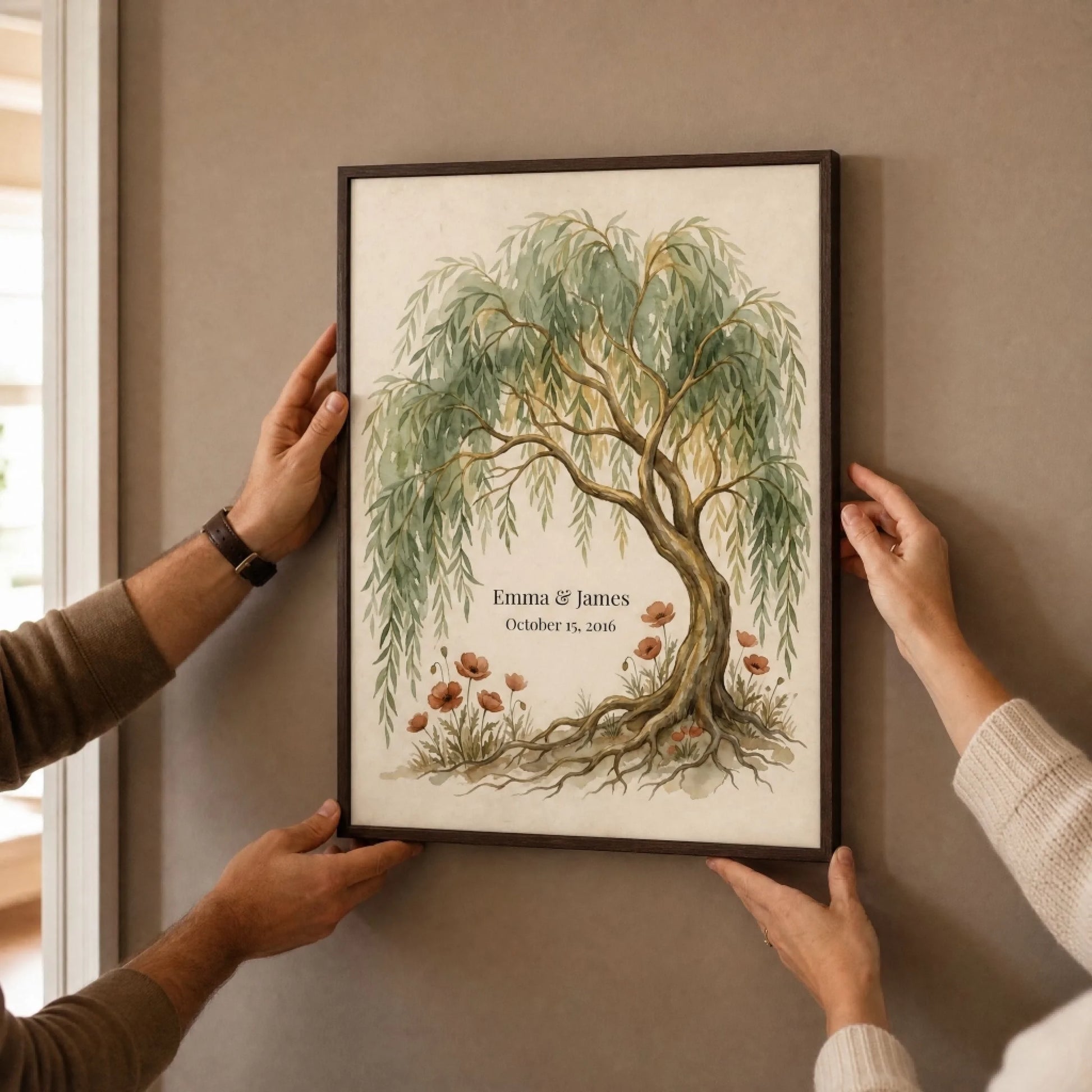 Two hands hanging the framed personalized willow tree 9th anniversary print on a plain wall