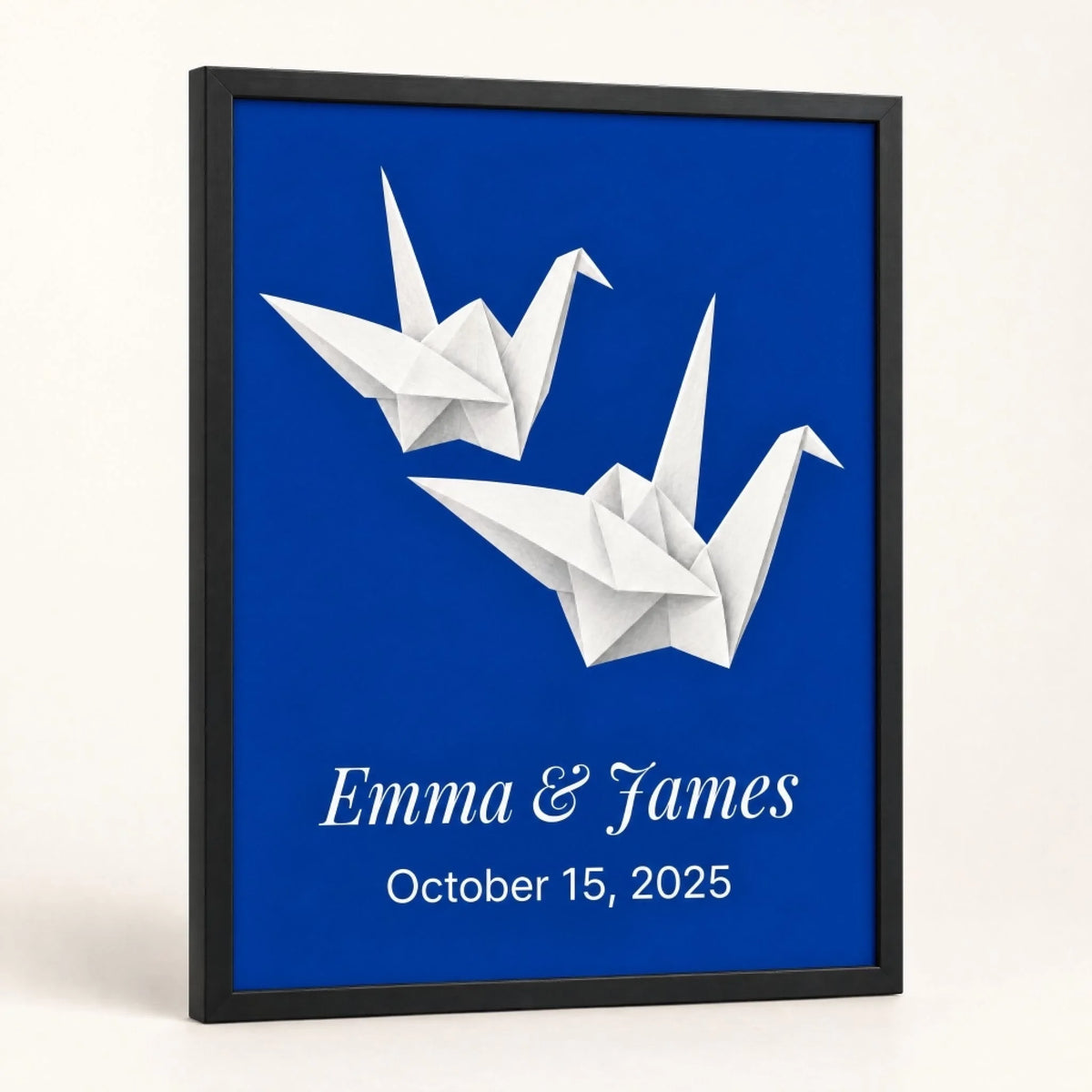 First anniversary paper cranes print, personalized with names and date, leaning in a black frame