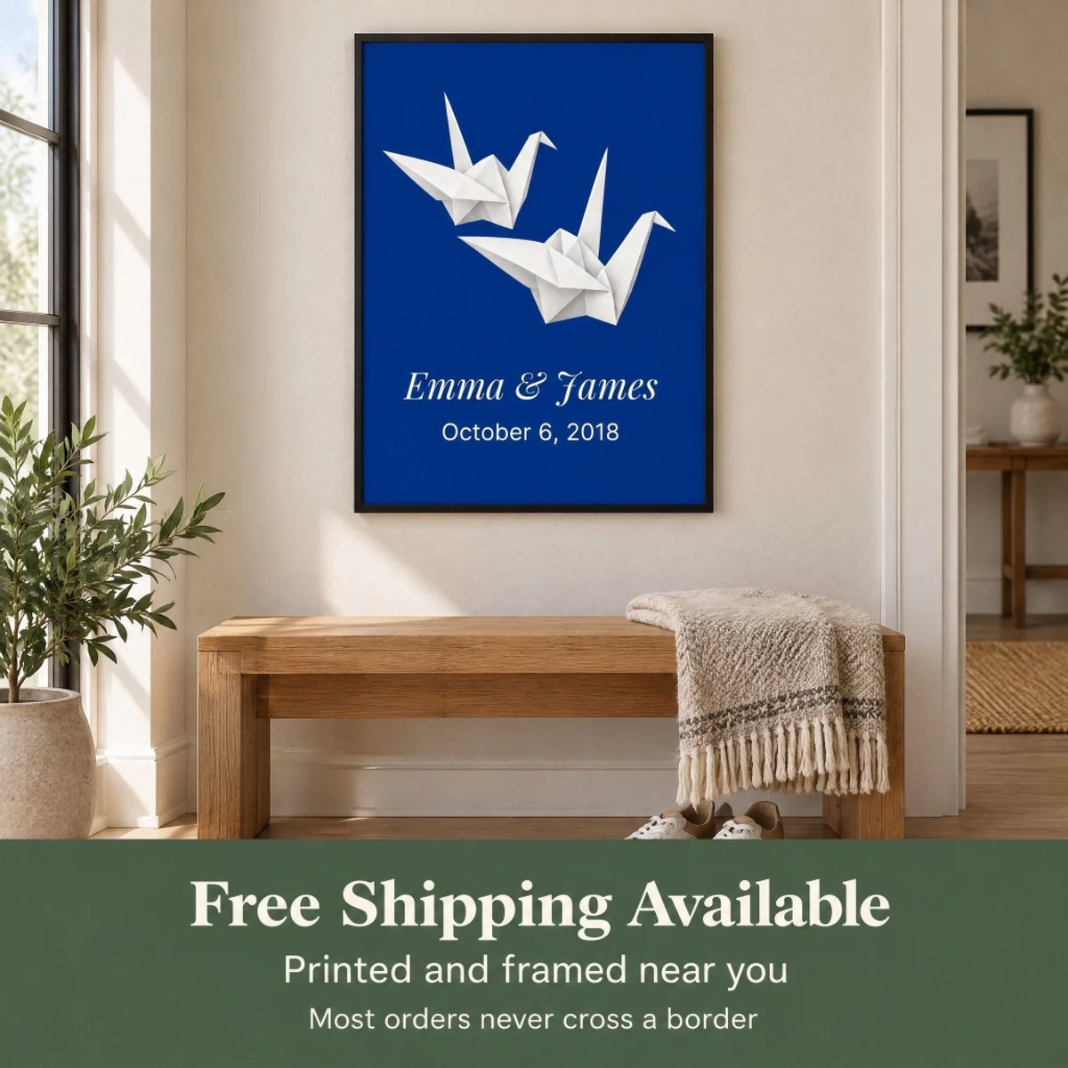 Framed paper cranes print in a hallway nook with the free shipping available promise