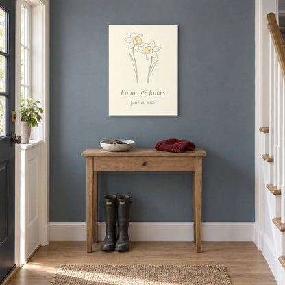 Personalized daffodil metal print hung above a hallway console in a family entry hall