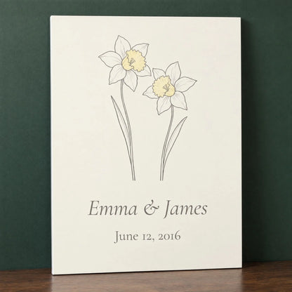 10th anniversary metal print with two daffodils, names and wedding date, leaning on a walnut console