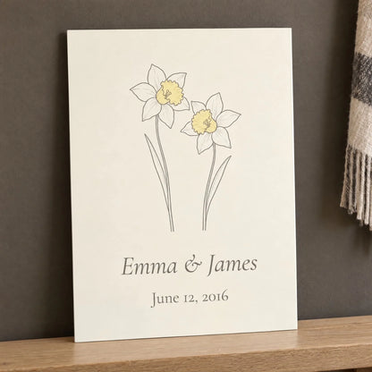 10 year anniversary gift: aluminum daffodil print with names and wedding date resting against a wall