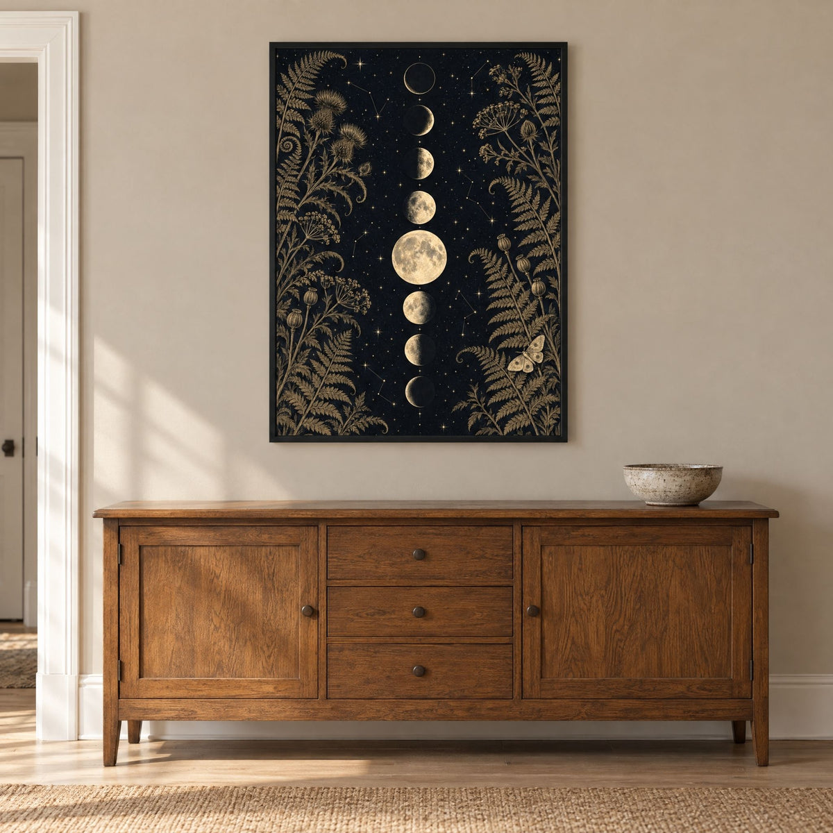 Large gothic moon phase print above a low oak sideboard, sized as a statement piece for a living room wall