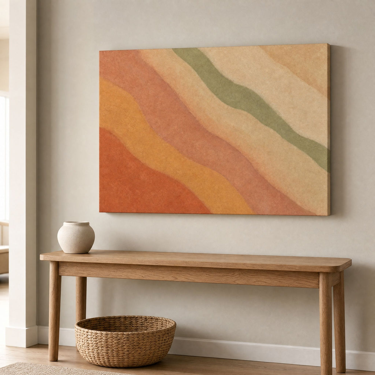 Canvas above a wooden hallway bench with a small vase and a woven basket