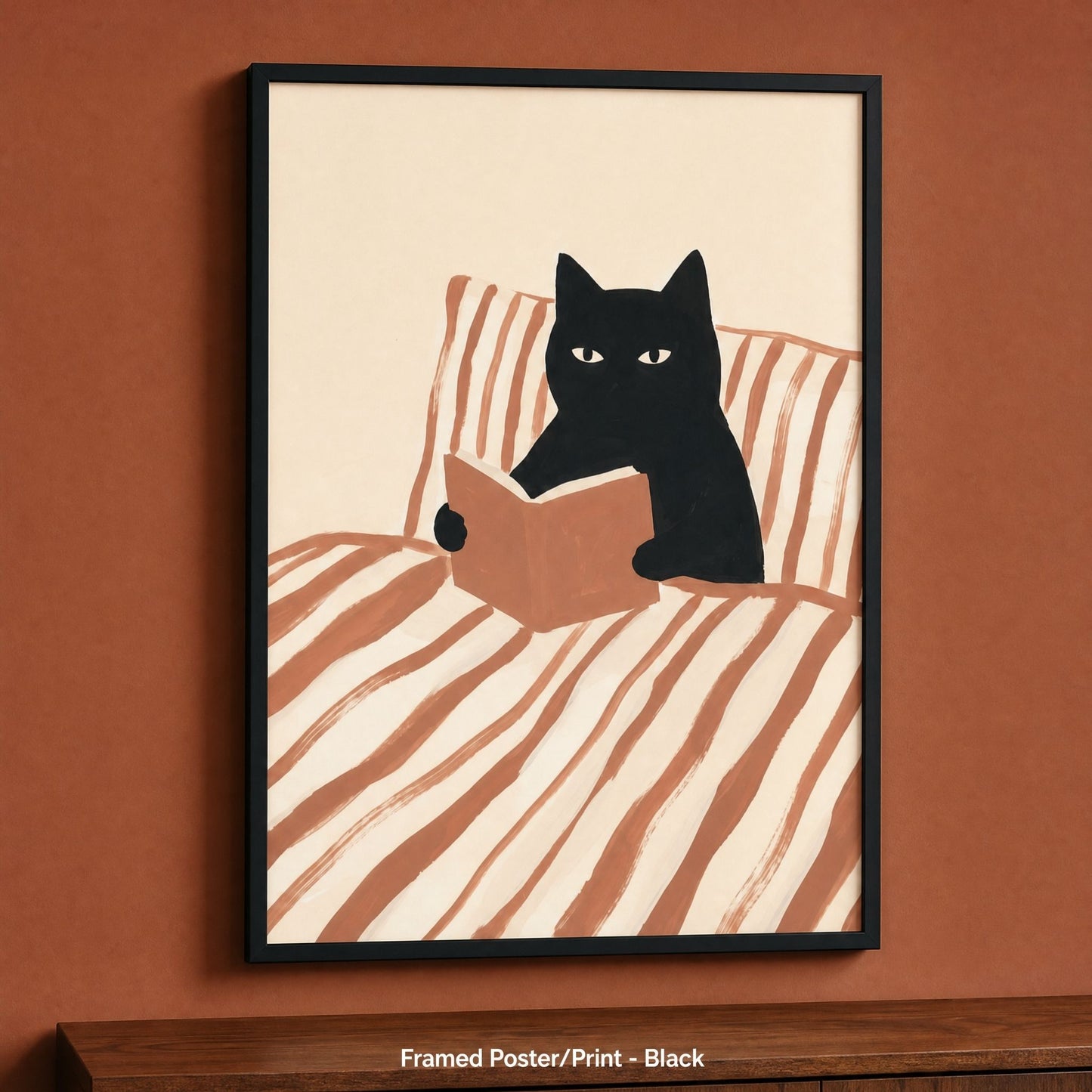 Cat reading poster in a black frame, one of four frame colours for this bookish print