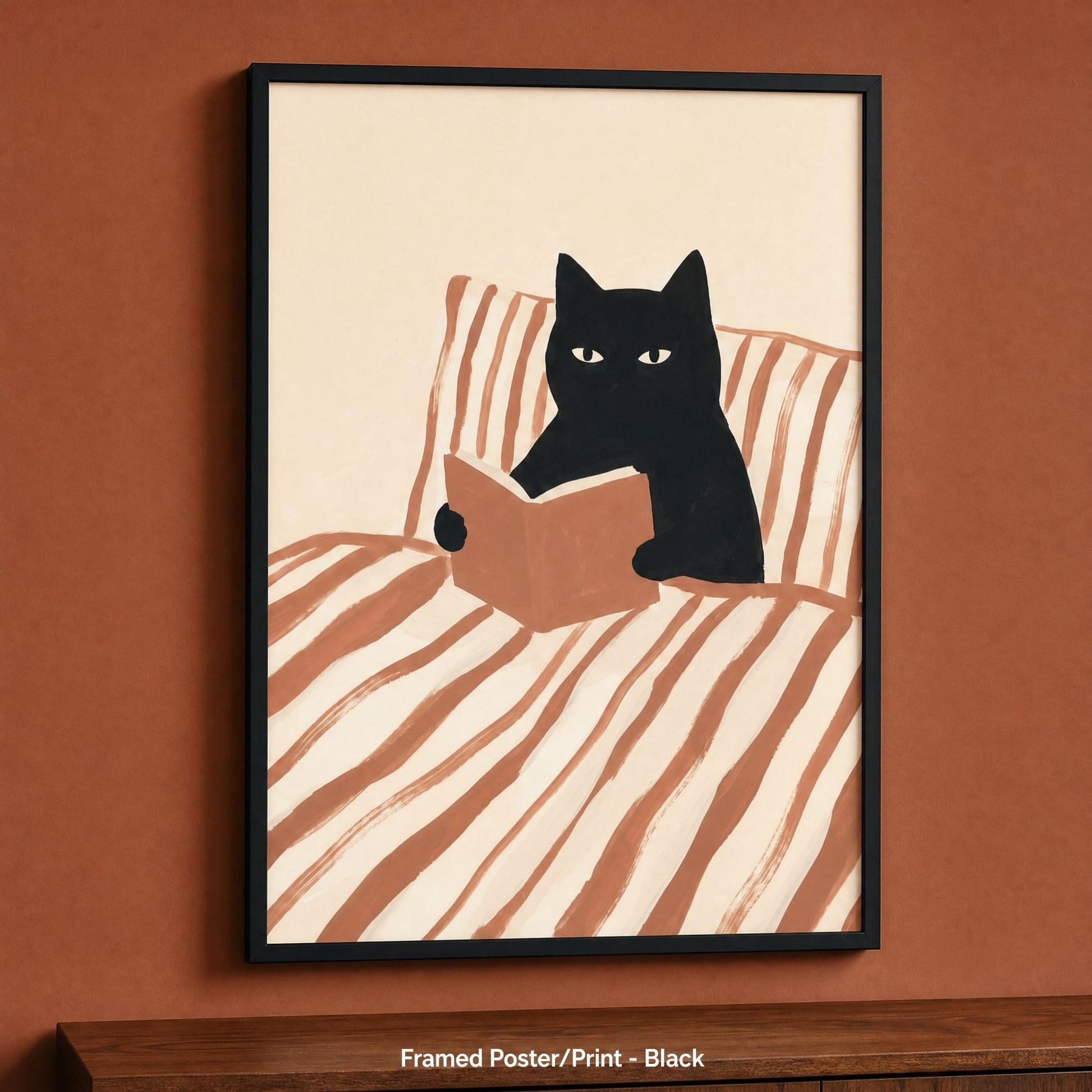 Cat reading poster in a black frame, one of four frame colours for this bookish print