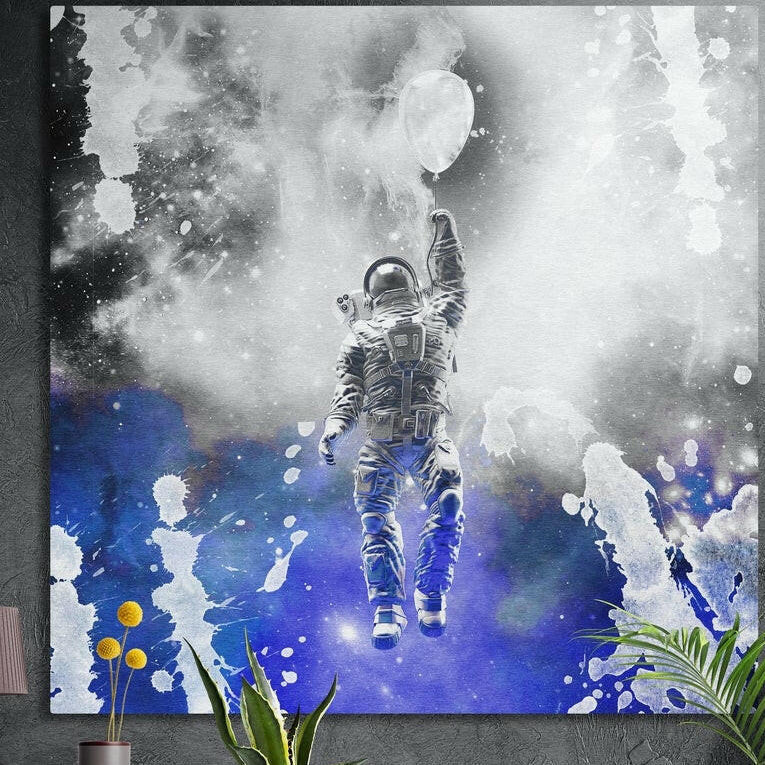 Astronaut floating up with a white balloon through white smoke over deep blue paint splashes, brushed aluminum wall art