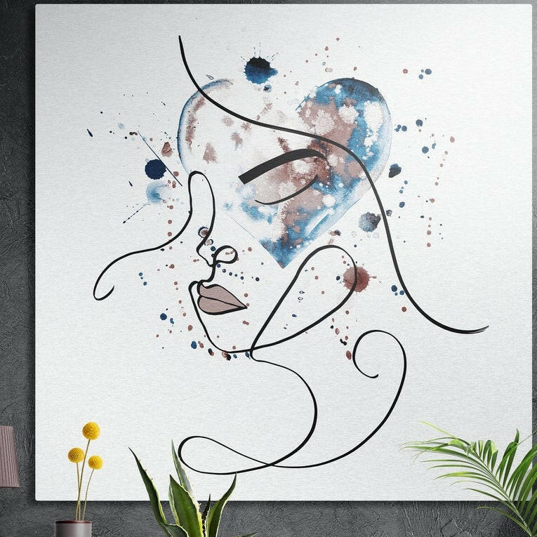 Continuous black line drawing of a woman's face over a blue and rose watercolor heart on white, brushed aluminum wall art