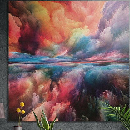 Coral, pink and teal clouds over a calm horizon, brushed aluminum wall art on a concrete wall behind plants