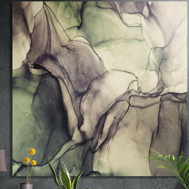 Flowing olive green, gray and ivory ink marble with fine dark veins, brushed aluminum wall art on a concrete wall