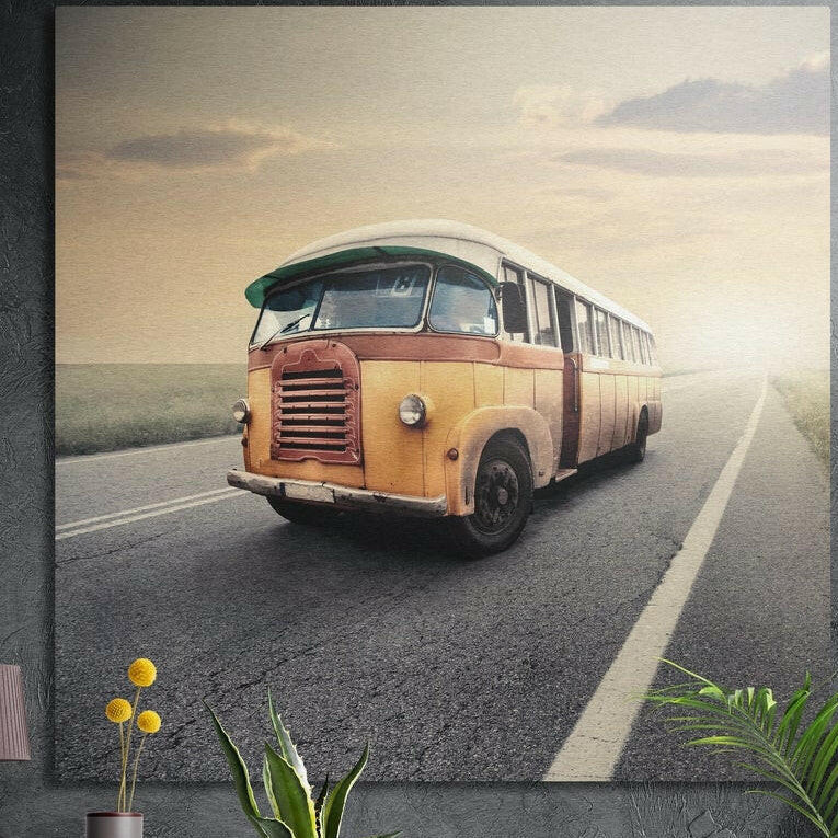 Weathered yellow vintage bus on an open road at dawn, brushed aluminum wall art on a dark wall behind plants