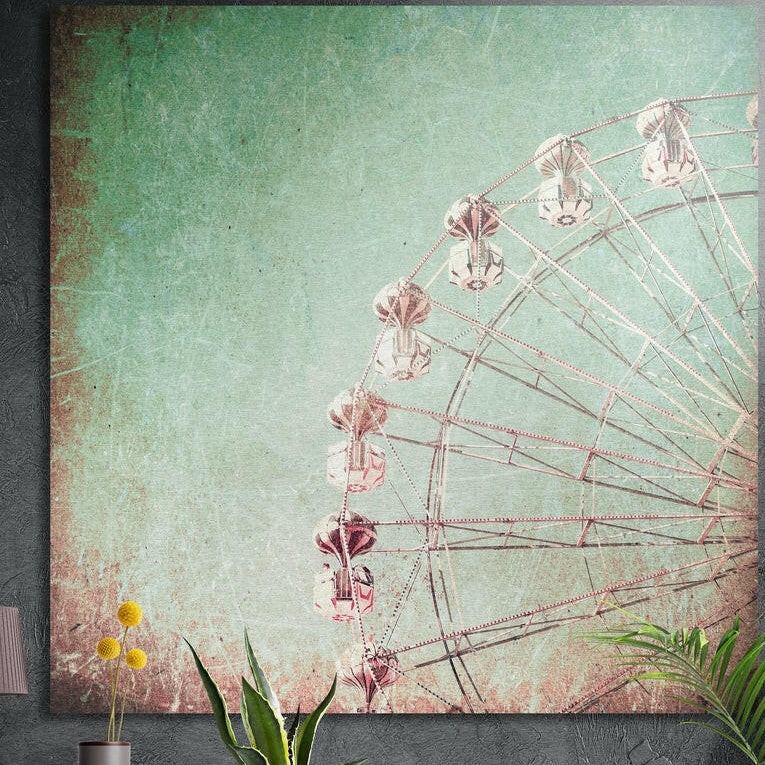 Vintage-style Ferris wheel on a mint sky with a worn texture, brushed aluminum wall art on a concrete wall behind plants