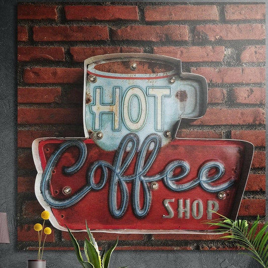 Retro Hot Coffee Shop sign with a blue cup and red panel on brick, brushed aluminum wall art behind plants