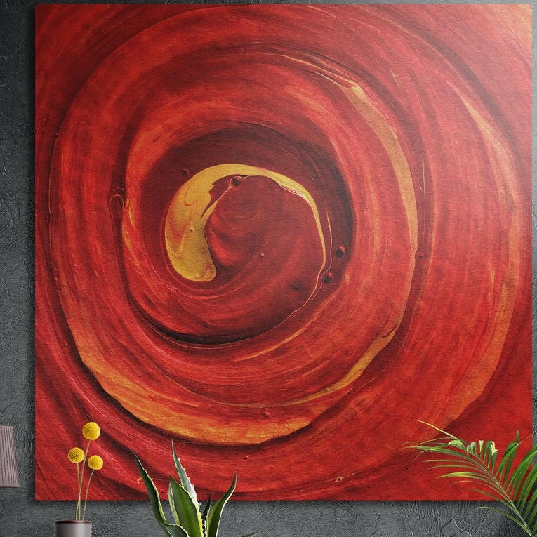 Deep red paint swirling in a spiral around a golden yellow center, like an opening rose, brushed aluminum wall art