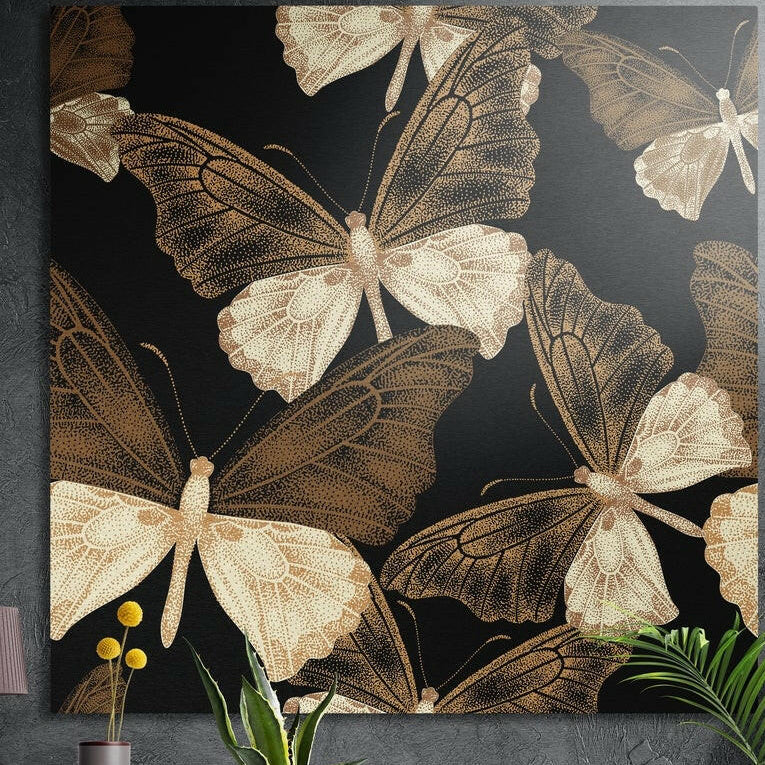Large gold and cream butterflies with fine wing veins spread across a black background, brushed aluminum wall art