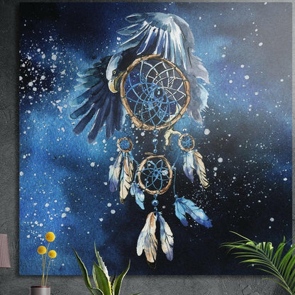 Blue and gold feathered dreamcatcher in a starry night sky, brushed aluminum wall art on a concrete wall behind plants