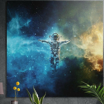 Astronaut floating with arms spread inside a glowing blue nebula with golden clouds, brushed aluminum wall art above plants