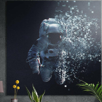 Astronaut in a white spacesuit breaking apart into floating pixel squares against dark space, brushed aluminum wall art
