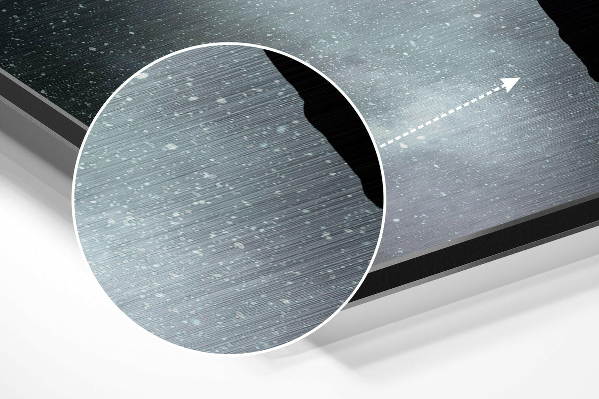 Magnified detail of the brushed metal grain showing through the man lifted by balloons across the moon print
