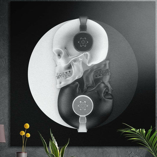 White and black skulls wearing headphones forming a yin yang circle, brushed aluminum wall art on a dark wall