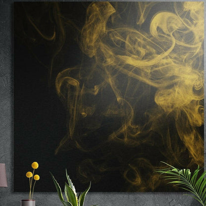 Golden smoke wisps curling over a black background, brushed aluminum wall art on a dark wall with plants in front