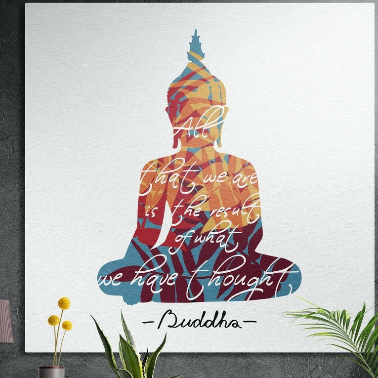 Seated Buddha silhouette filled with red, orange and teal leaves and white script on white, brushed aluminum wall art