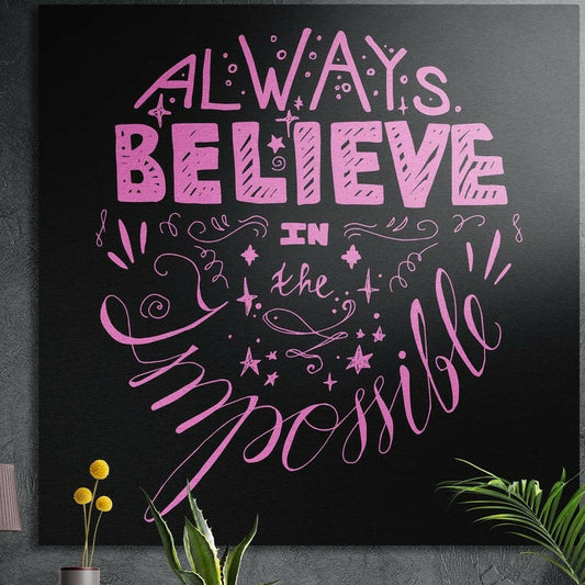 Pink hand lettered quote beginning Always Believe with swirls and stars on black, brushed aluminum wall art