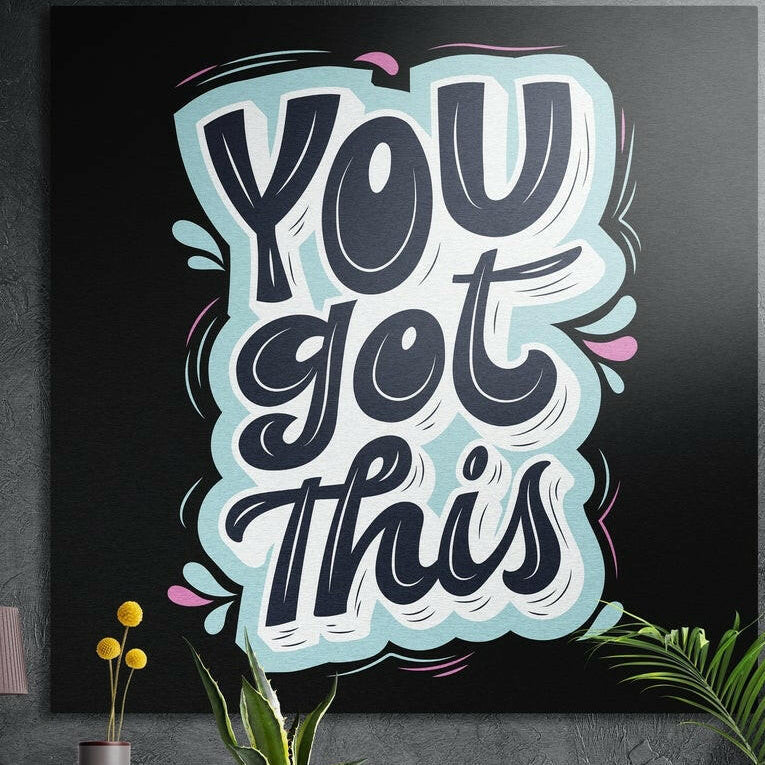 You got this navy lettering on a pale aqua shape with pink splashes, brushed aluminum wall art on a dark wall