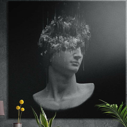 Gray classical bust with glitched head brushed aluminum wall art on a gray wall above yellow flowers and plants