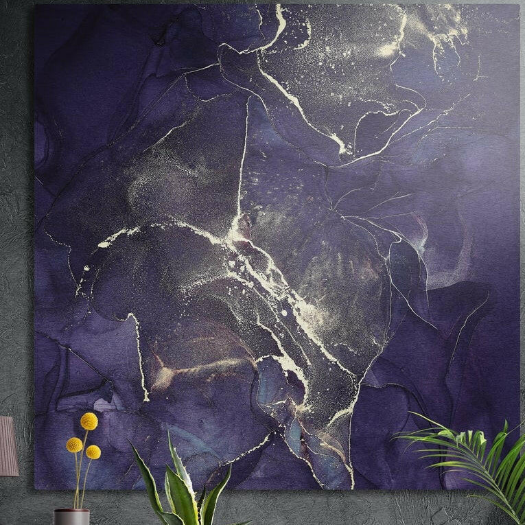 Deep purple and gold marble brushed aluminum wall art on a dark concrete wall above potted plants and yellow flowers