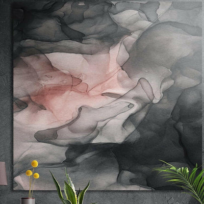 Blush pink and gray ink cloud brushed aluminum wall art on a dark wall above yellow flowers and plants