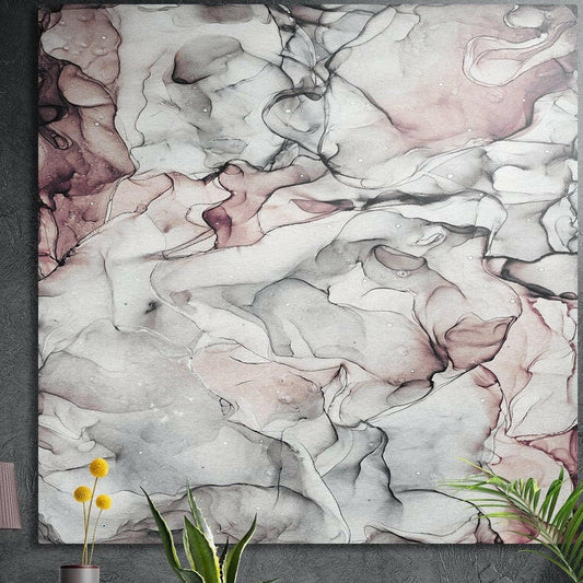 White and pink veined marble brushed aluminum wall art on a dark concrete wall behind potted plants