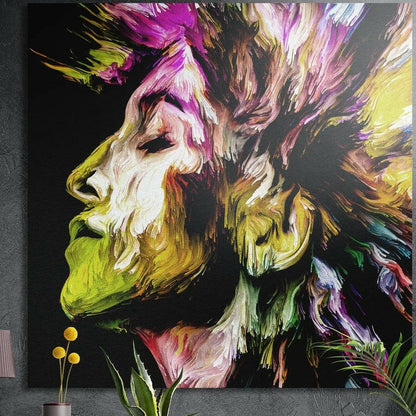 Yellow and magenta brushstroke profile brushed aluminum wall art on a dark concrete wall above yellow flowers and plants