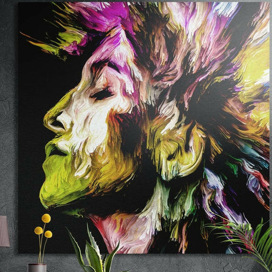 Yellow and magenta brushstroke profile brushed aluminum wall art on a dark concrete wall above yellow flowers and plants