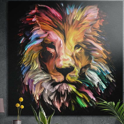 Lion face of swirling rainbow brushstrokes on black brushed aluminum wall art on a gray concrete wall above plants