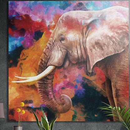 Elephant with ivory tusks on a colorful splash background, brushed aluminum wall art on a gray wall above yellow flowers