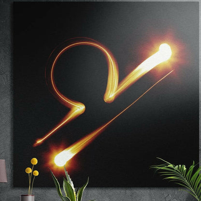 Libra zodiac sign in blazing orange light brushed aluminum wall art on a gray concrete wall above plants