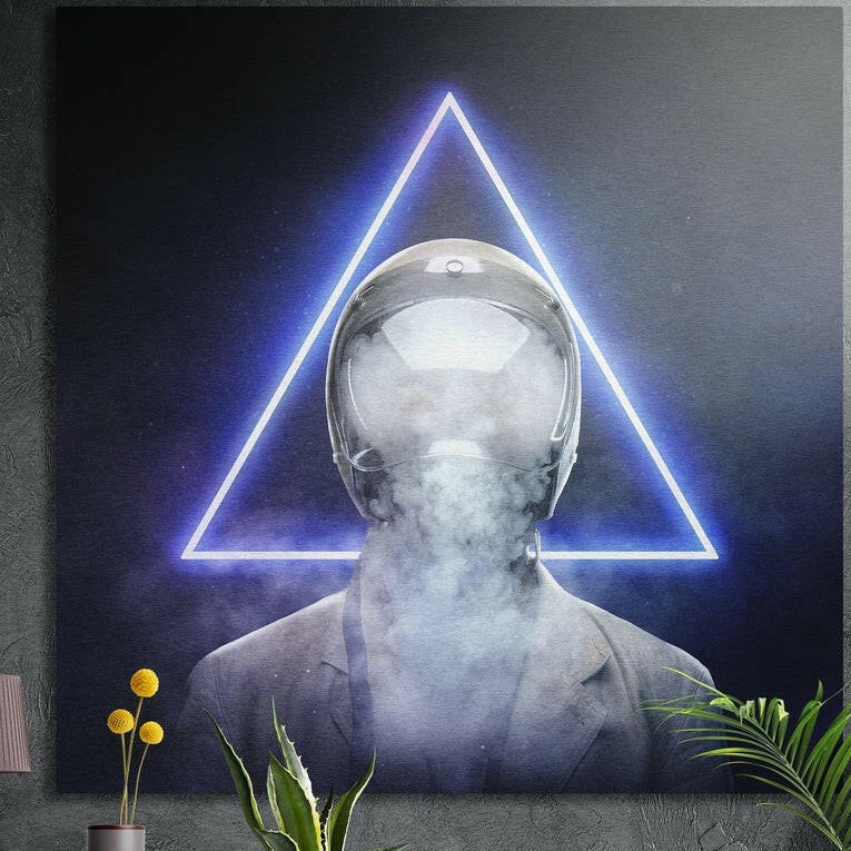 Suited figure with a smoke-filled helmet before a blue neon triangle, brushed aluminum wall art on a dark wall