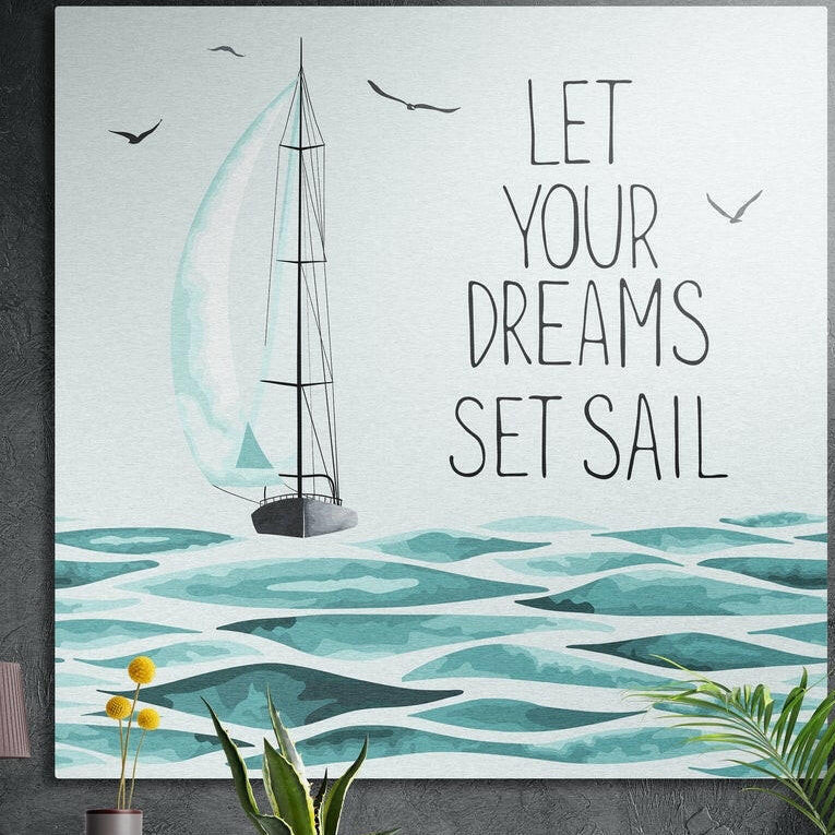 Let your dreams set sail sailboat brushed aluminum wall art on a dark textured wall above potted plants