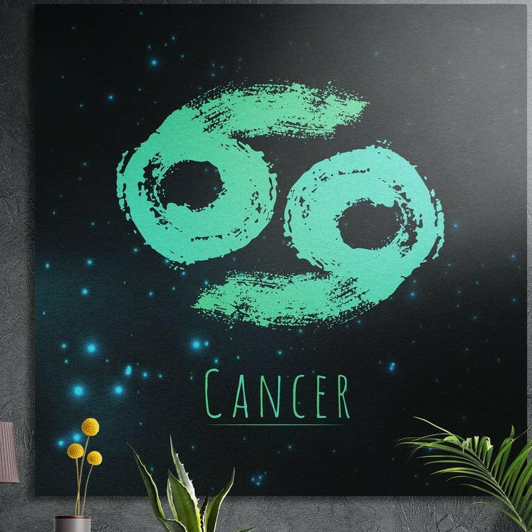 Cancer zodiac sign in mint green brushstrokes brushed aluminum wall art on a gray concrete wall above plants