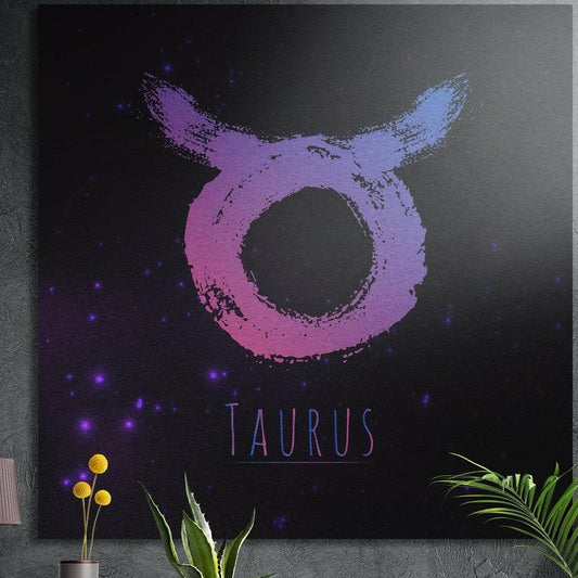 Taurus zodiac sign in pink purple brushstrokes brushed aluminum wall art on a gray concrete wall above plants