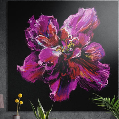 Magenta pastel peony on black, brushed aluminum wall art on a dark concrete wall behind green plants and a small vase