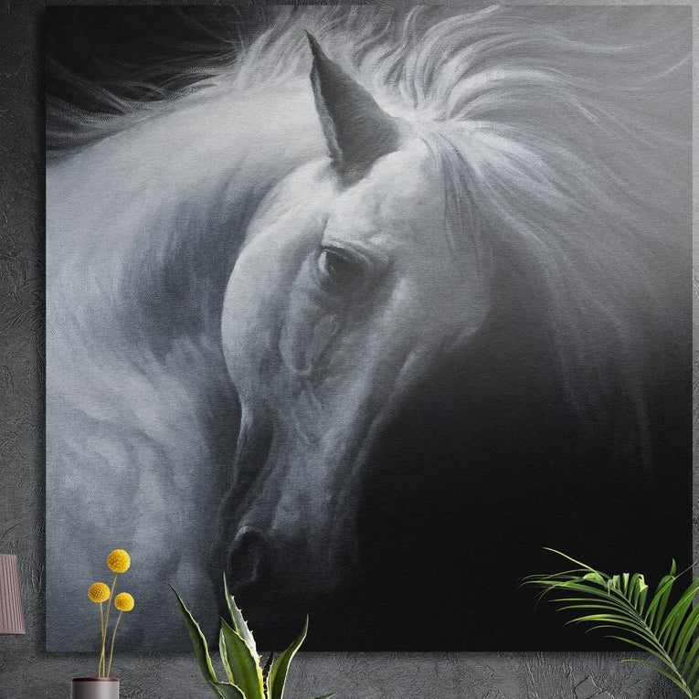 White horse with flowing mane brushed aluminum wall art on a dark concrete wall above a vase and plants