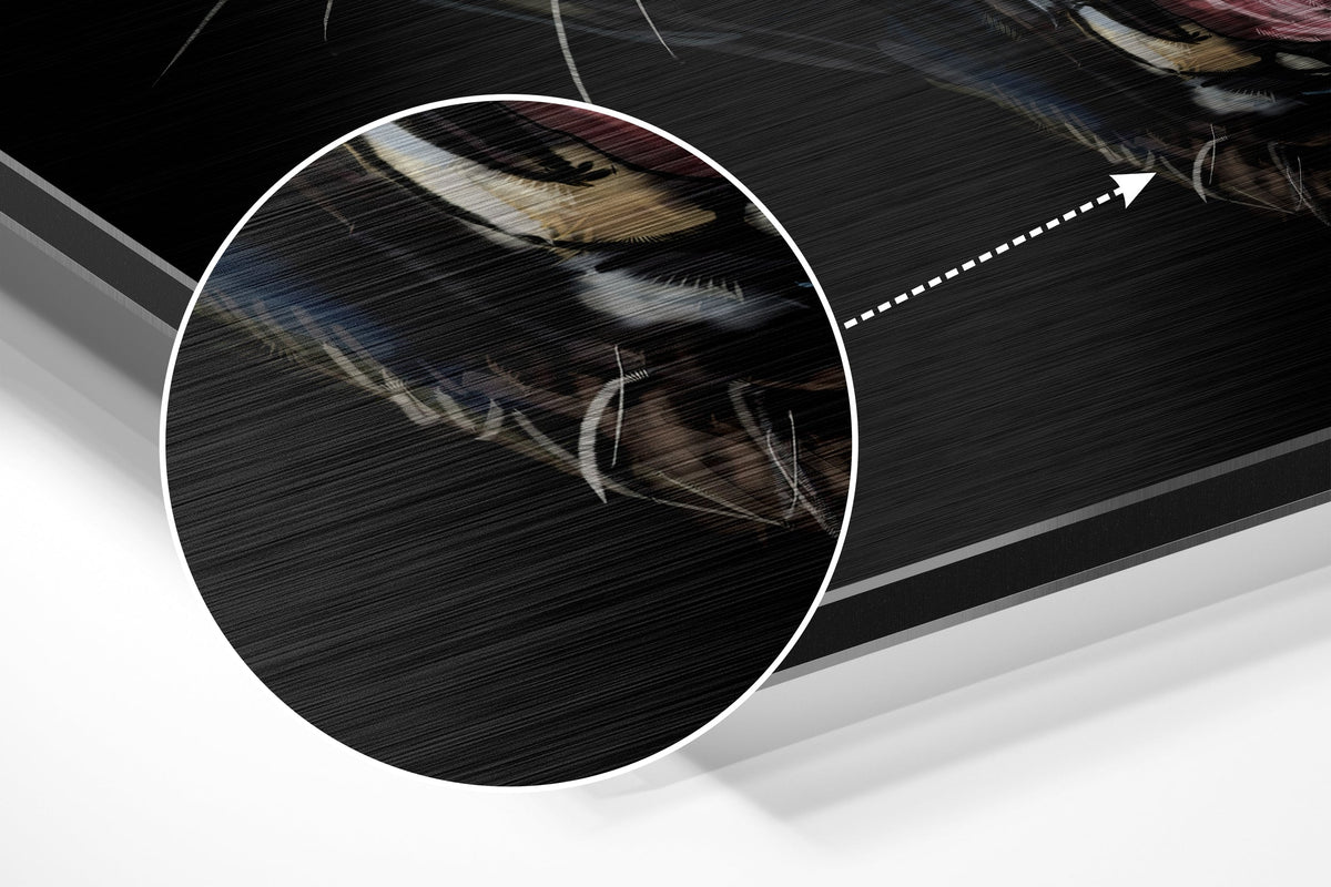 Magnified detail of the brushed metal grain showing through the snarling black panther print