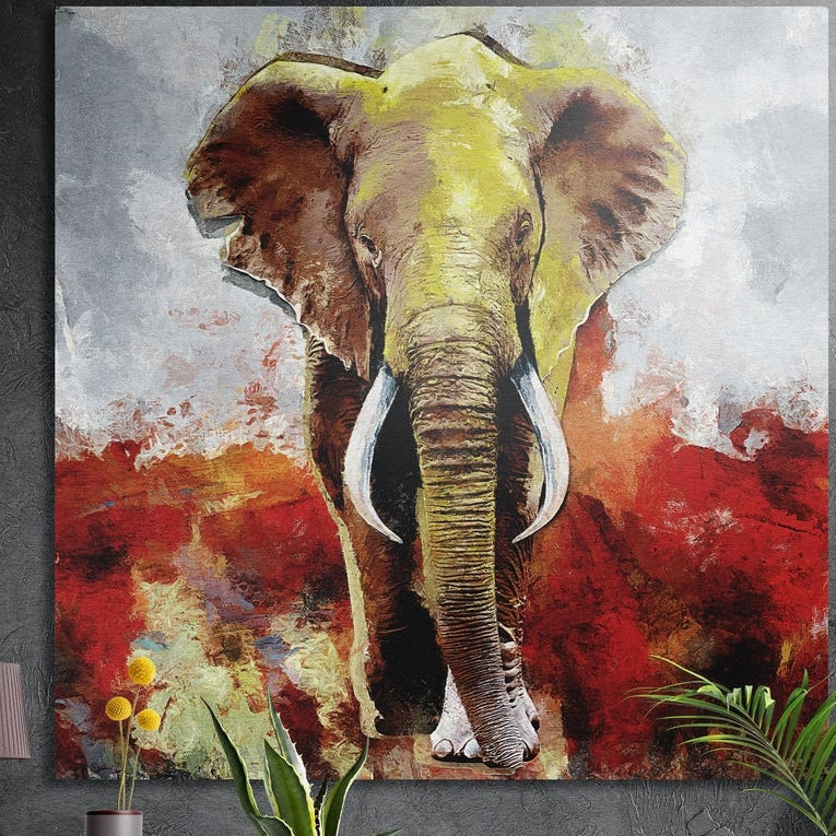 Painted elephant on red and gray brushed aluminum wall art on a dark wall behind yellow flowers and green plants