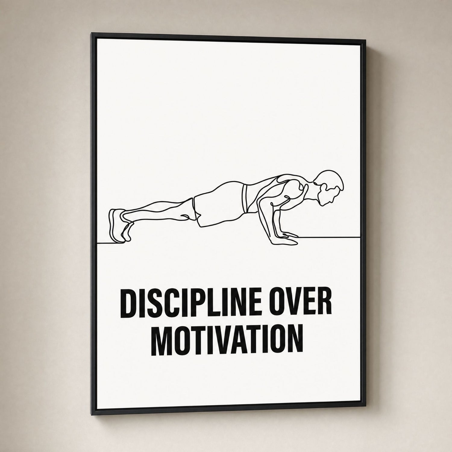 A framed minimalist fitness poster on a light beige wall. The poster features a black line drawing of a person in a plank position with the bold text 'DISCIPLINE OVER MOTIVATION' underneath, enclosed in a thin black frame.