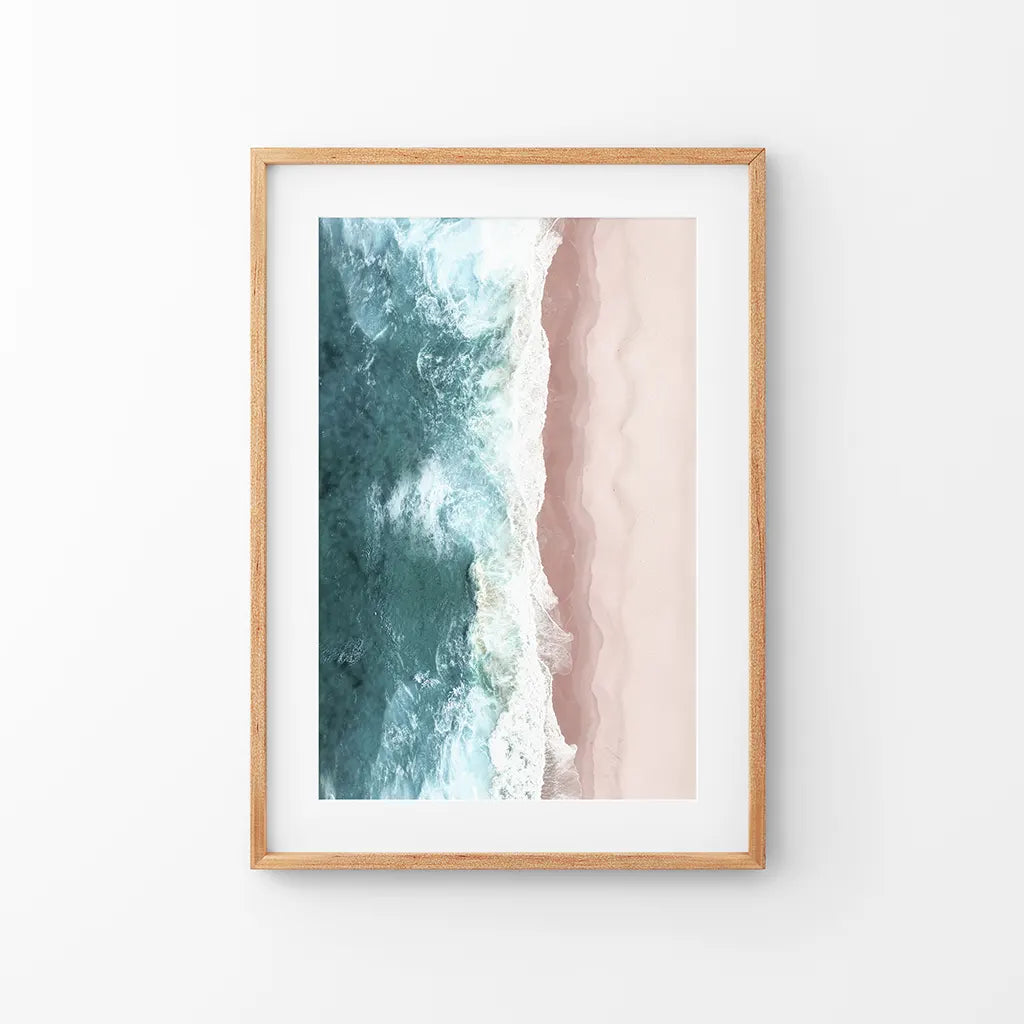 Aerial view of blue ocean waves on pink sand beach, coastal wall art print